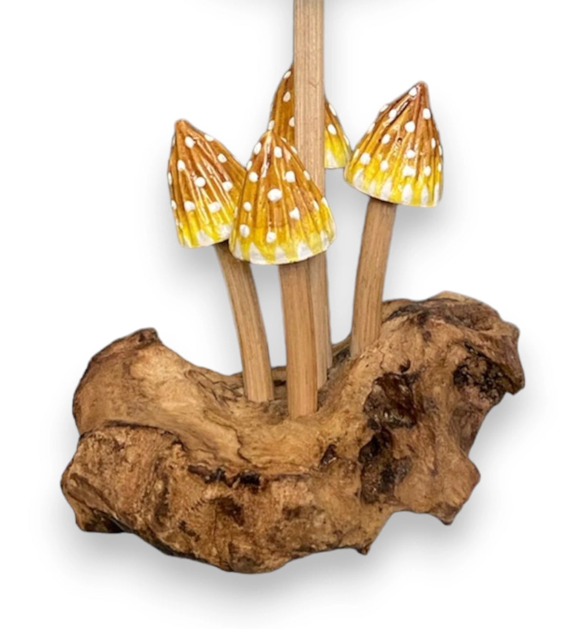 4 pointed yellow cap mushrooms with single candle holder