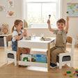 HOMCOM Three-Piece Kids Table and Chair Set with Blackboard, Storage, Bookshelves - Natural Wood