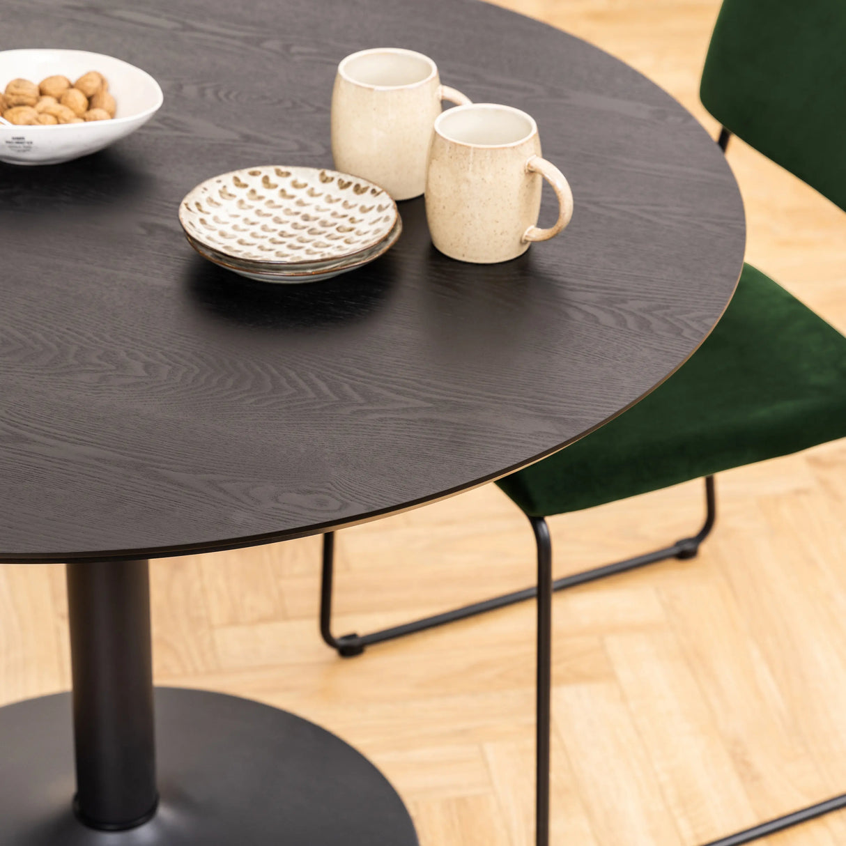 Ibiza Round Dining Table with Black Ash Top and Matt Black Base 110x74cm