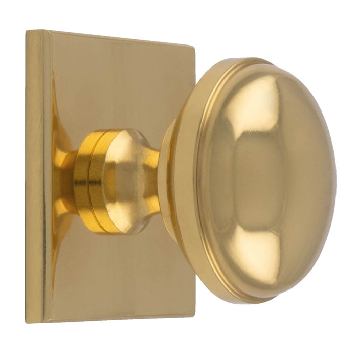 WARWICK KNOB ON SQUARE BACKPLATE - POLISHED BRASS - SET