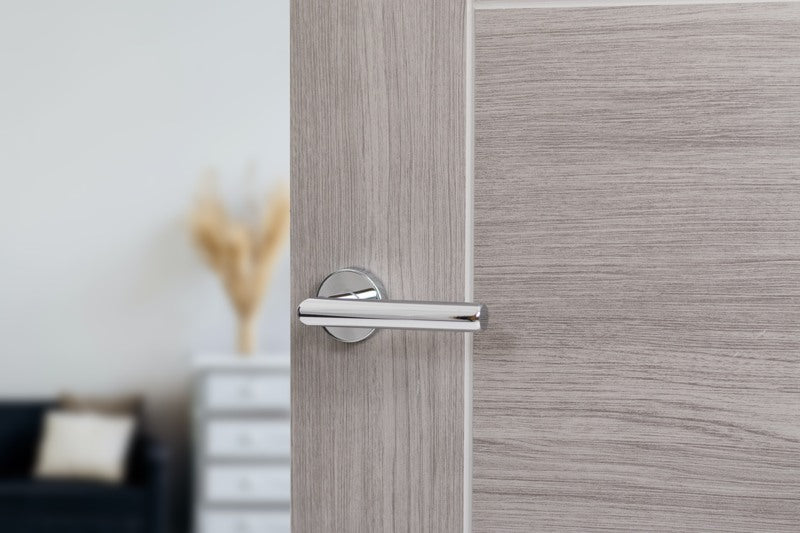 Forme Elle Lever Door Handle on Minimal Round Rose - Polished Chrome - Set