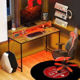 HOMCOM 120cm Computer Desk with LED Lights and Power Outlets, Gaming Desk with Monitor Stand, Computer Table with Remote for Home Office Study, Rustic Brown