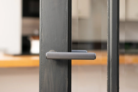 Millhouse Brass Stephenson Lever Door Handle on Concealed Round Rose - Matt Black - Set