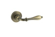 Old English Wrexham Lever Door Handle on Round Rose - Matt Antique Brass - Set