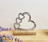 Metal Silver Four Heart Ornament On A Wooden Base Small