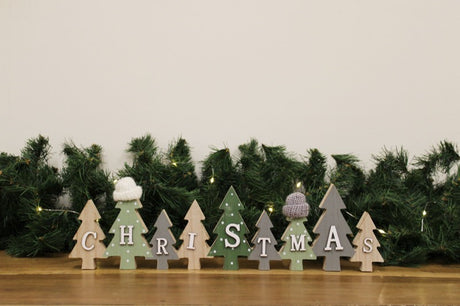 Row of Christmas Trees Decoration With Hats Green