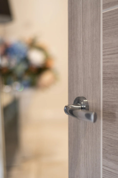 STATUS Nevada Lever Door Handle on Round Rose - Polished Chrome - Set