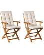 Set of 2 Garden Dining Chairs Light Wood with Light Beige Cushions Acacia Wood Frame Folding Rustic Design Beliani